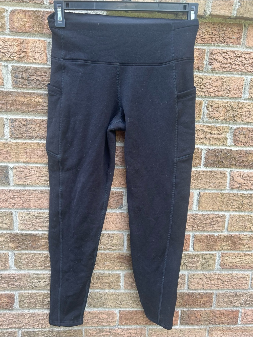 Athleta Black High-Rise Leggings with Side Pockets size medium